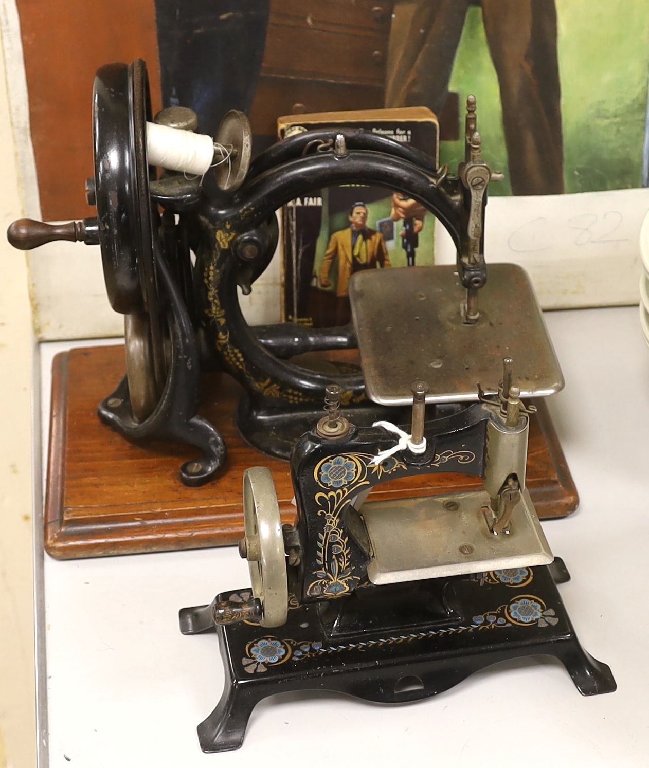 A Victorian Wilcox ad Gibbs sewing machine and a smaller sewing machine, 28cm high